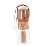 “3-in-1 Portable Pet Water & Food Cup with Waste Bag Dispenser – Multi-Functional Travel Bottle for Dogs & Cats”